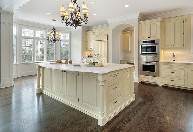 a modern kitchen with newly installed laminate floor in Apple Valley