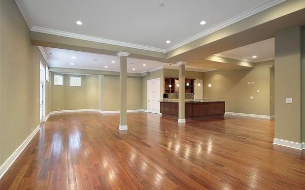 while it is possible, it's generally not recommended to install wood flooring in bathrooms or kitchens due to moisture